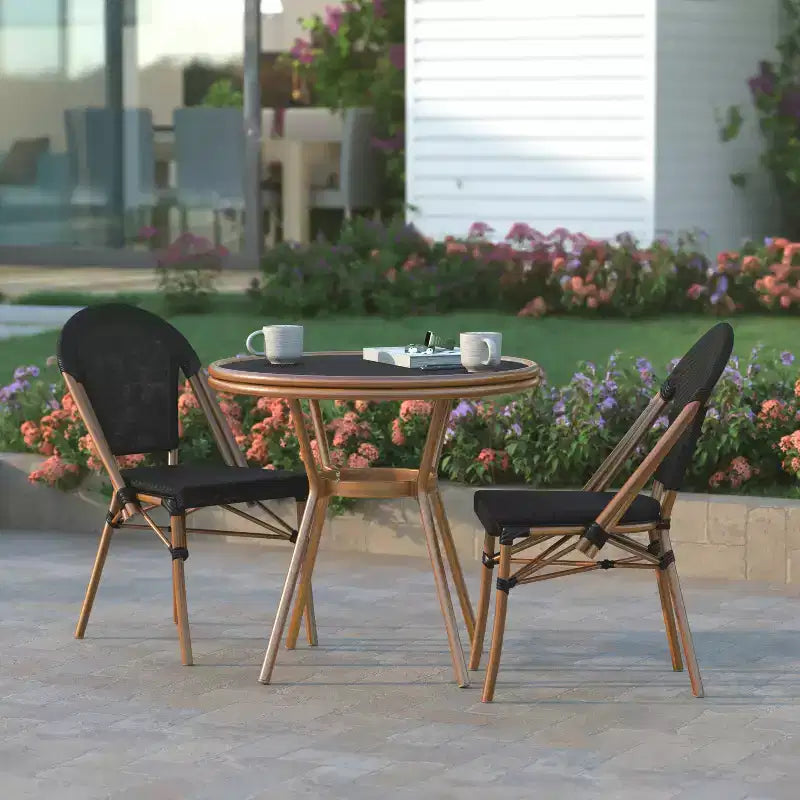 Table de style bistrot Massalia Emma & Oliver, de 80 cm, pour l'intérieur et l'extérieur, avec textilène, plateau en verre et cadre en métal finition bambou