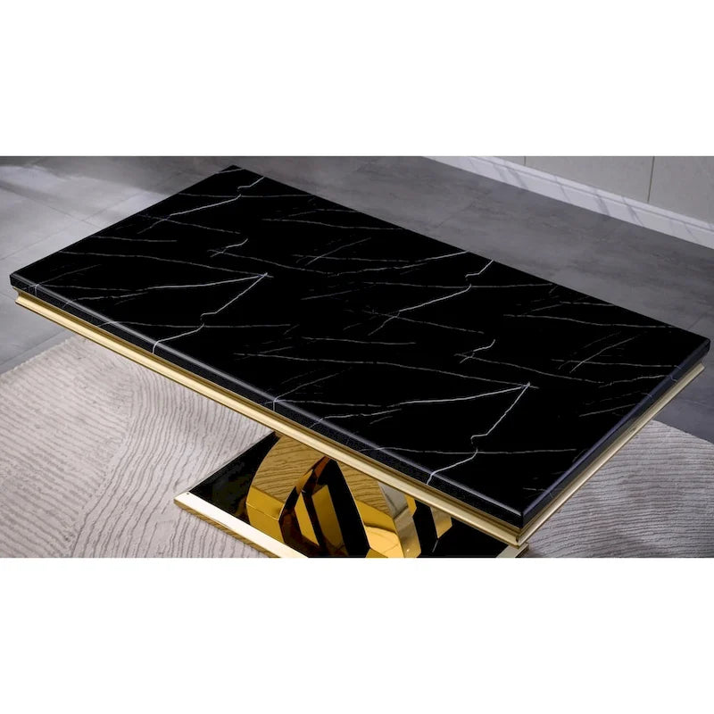 Table de salle à manger noire avec pieds en métal doré poli