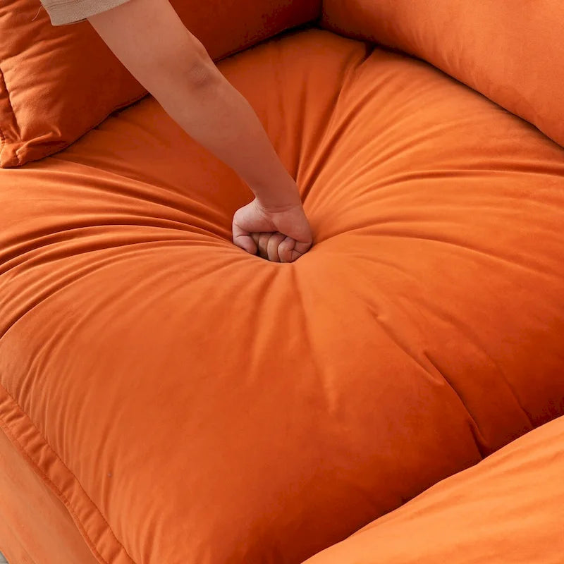 Canapé d'angle modulable en velours "Cloud" avec plumes et duvet, convertible et très large.